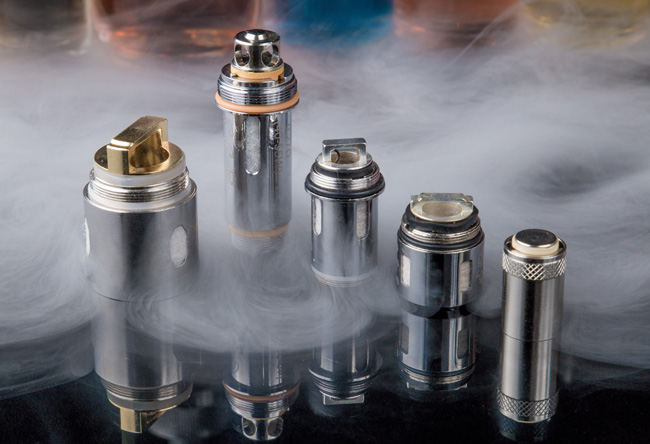 A selection of different coils surrounded by swirling vapour.